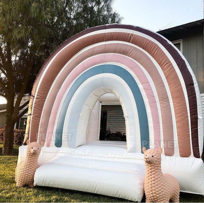 China PVC tarpaulin outdoor party rental Inflatable Rainbow bouncer with slide kids combo bounce house wholesale
