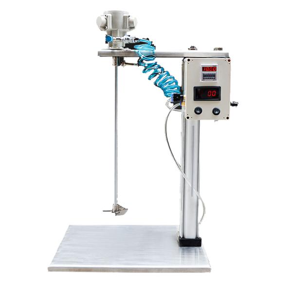 Side view of pneumatic mixer with industrial background