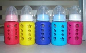 China 4 oz Glass milk feeding bottle 120ml with silicone sleeve and cover on sale