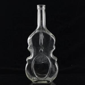 China 700ml Guitar Shaped Glass Bottles With Cork Cap for Clear or Customized Vodka Whisky on sale