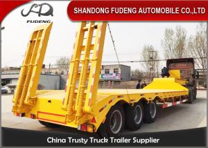 China Tri Axle Low Bed Semi Truck Trailer For Sale 60 Ton Heavy Machine Transport wholesale